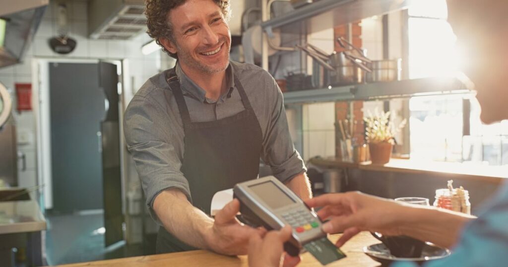 digital nomad paying with a card in Spain