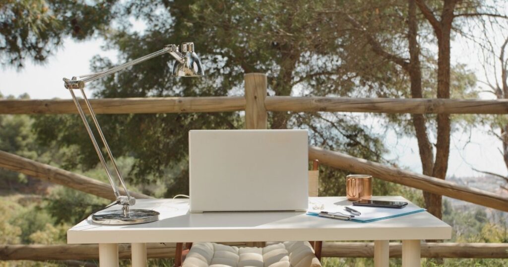 laptop in a table outside of the house