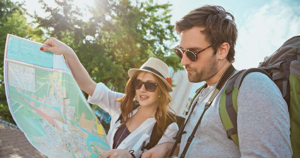 couple looking at a map while traveling in France