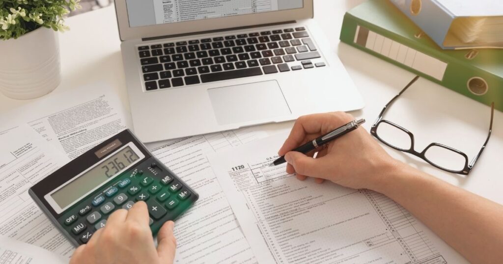 person calculating the costs of a travel insurance for Canada