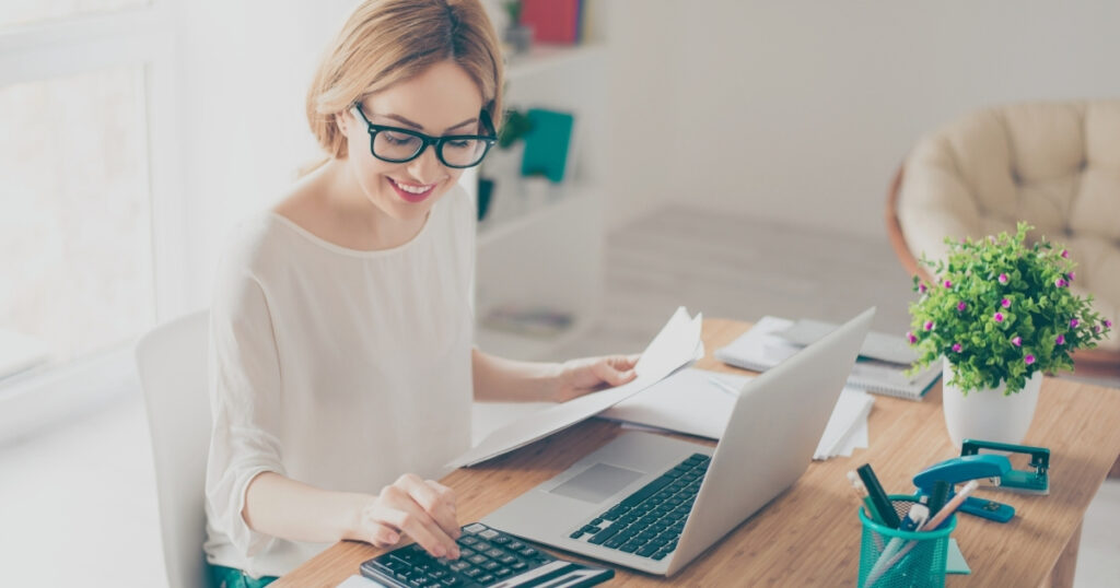 young woman checking the taxes she needs to pay in italy