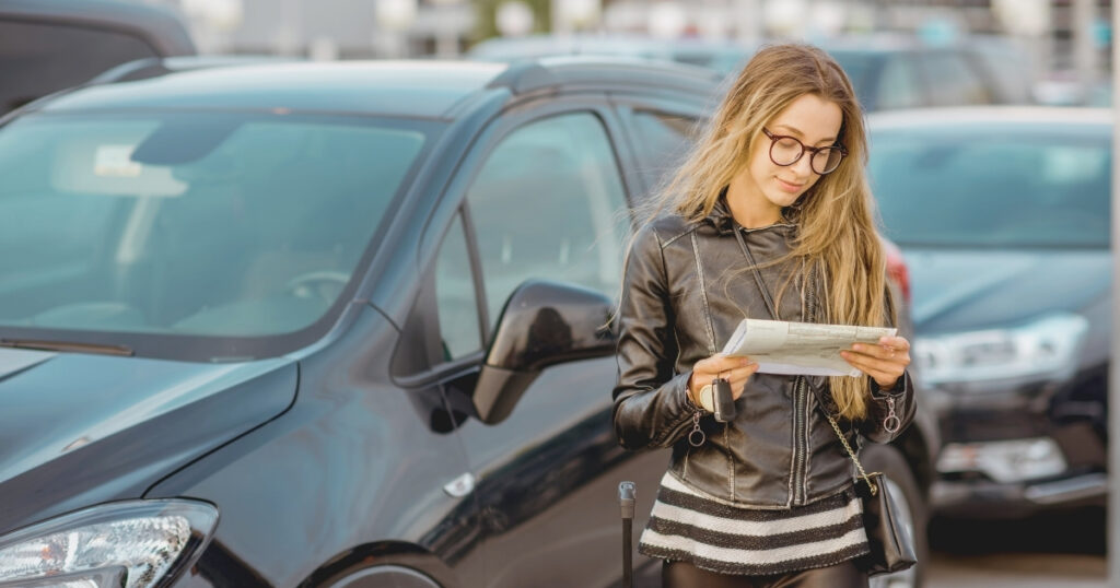 young woman renting a car in Brazil
