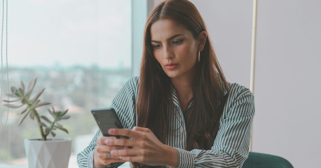 young woman using internet with an esim