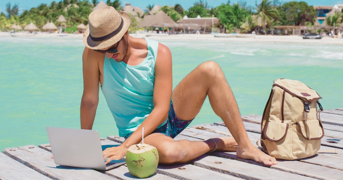 digital nomad man using internet in his laptop