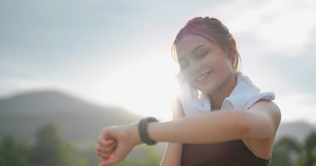 young woman using her esim smartwatch