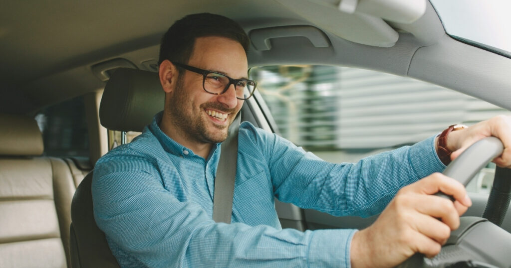 smiling man driving in Indonesia