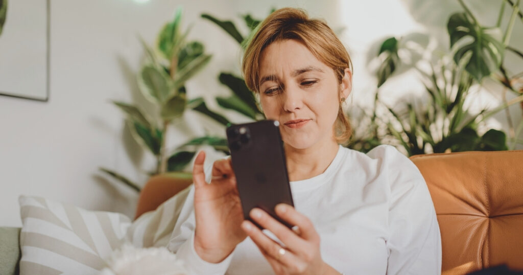 woman using an esim in her smartphone
