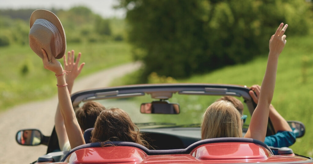 friends traveling by car in France