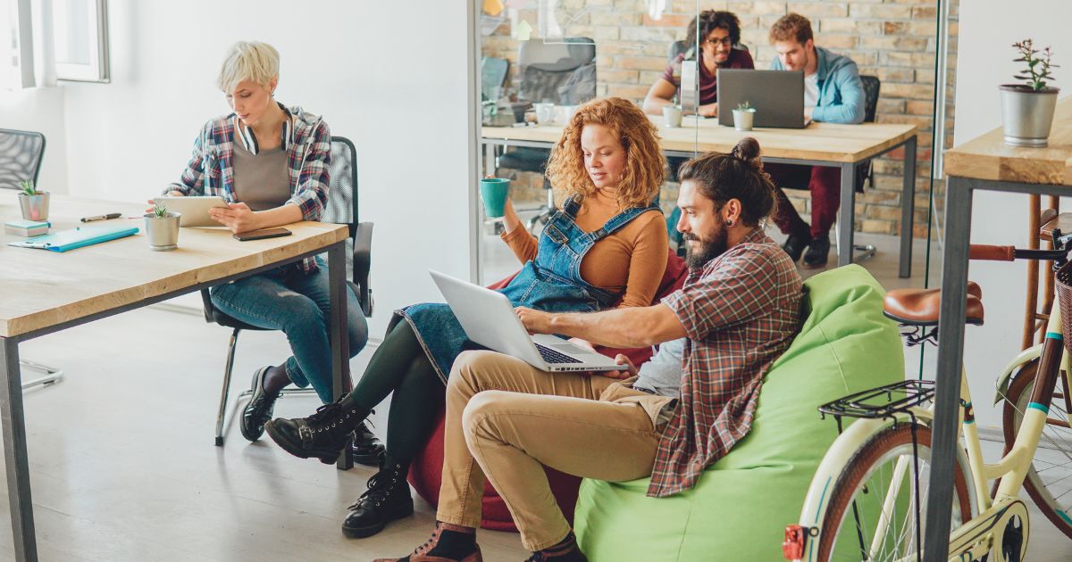people working remotely in one of the best coworking spaces in Italy