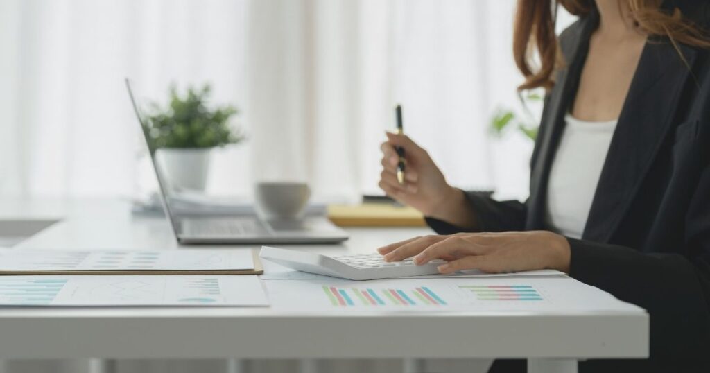 woman calculating taxes to pay in Spain