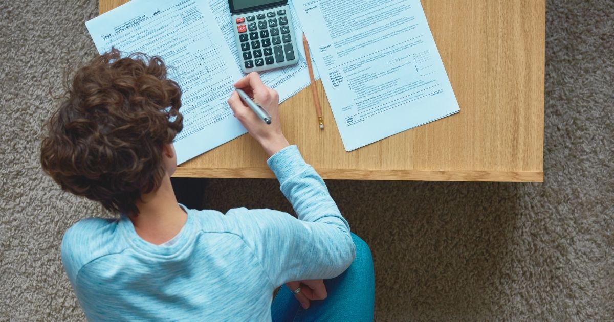 young man filling the taxes in the US