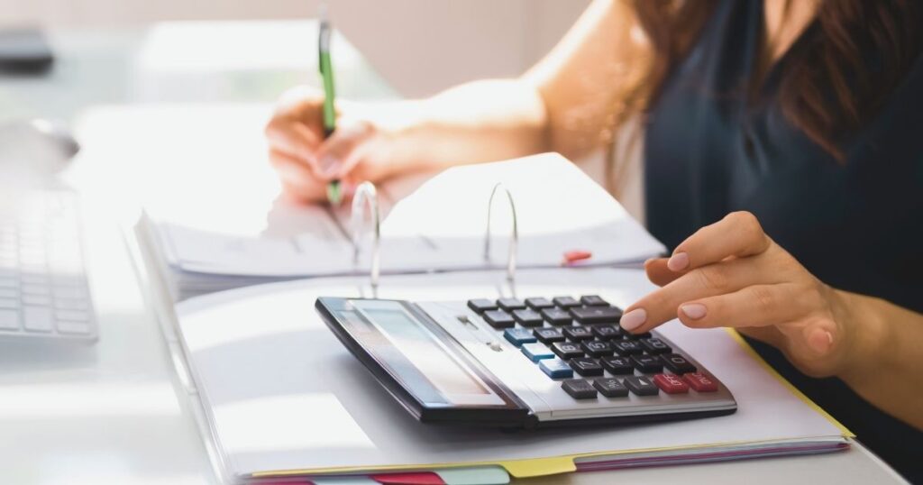 woman calculating taxes in the US