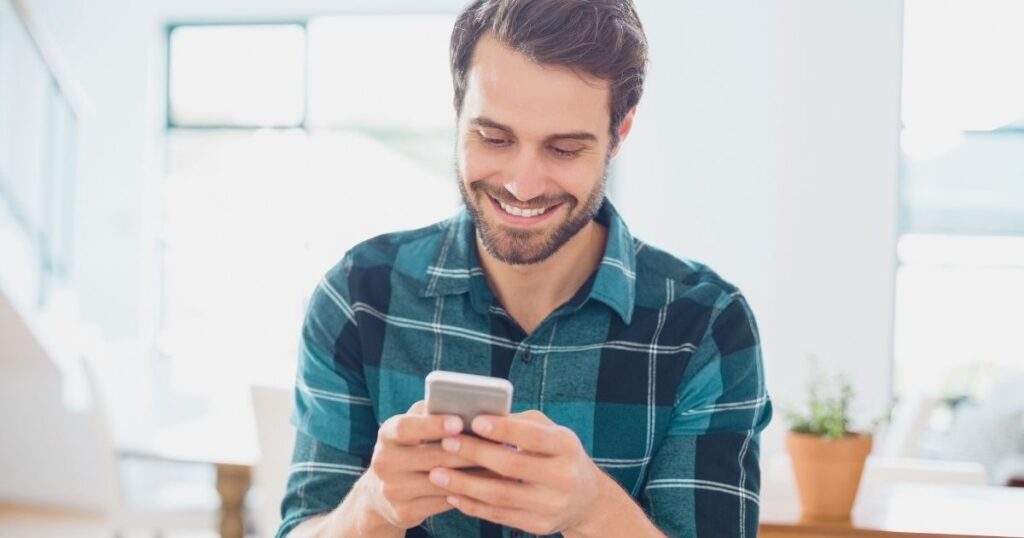 man checking which mobile devices are compatible in the United States