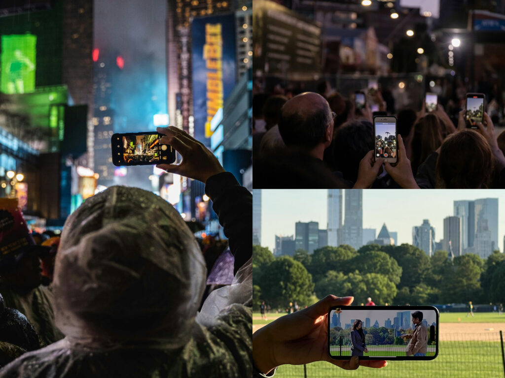 Personas tomando fotografías con sus móviles en Nueva York.