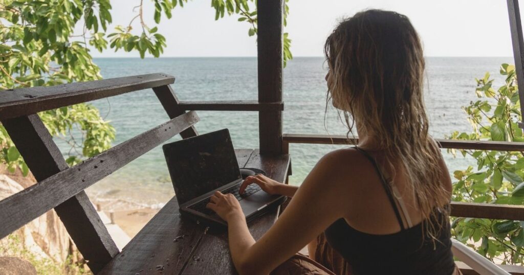 digital nomad woman working remotely with the digital nomad visa