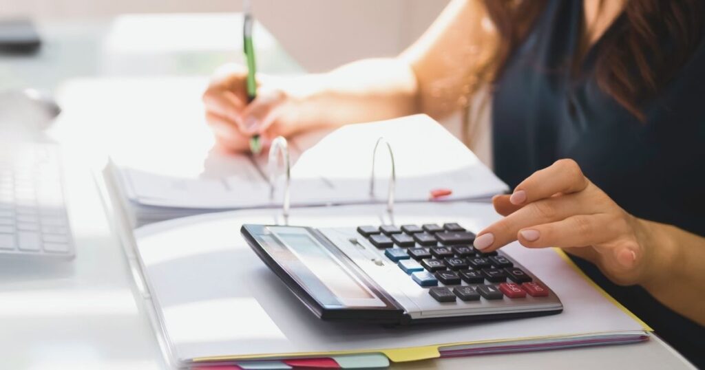 woman filling a tax model to keep up with taxes in Spain