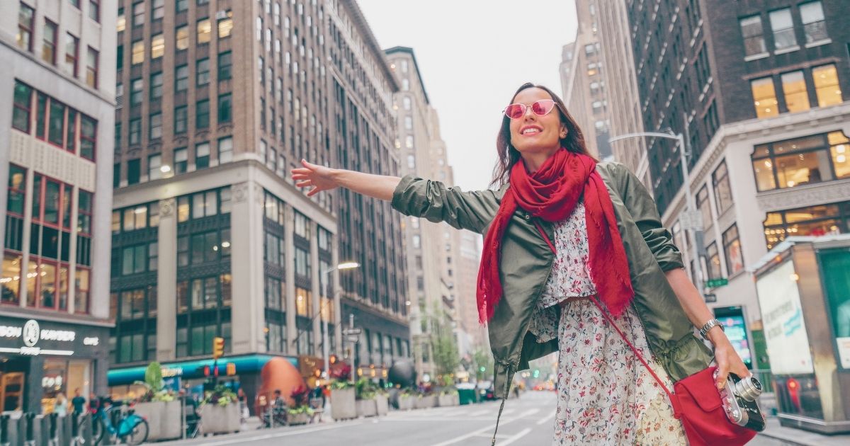 digital nomad woman enjoying her trip to the USA with a travel insurance