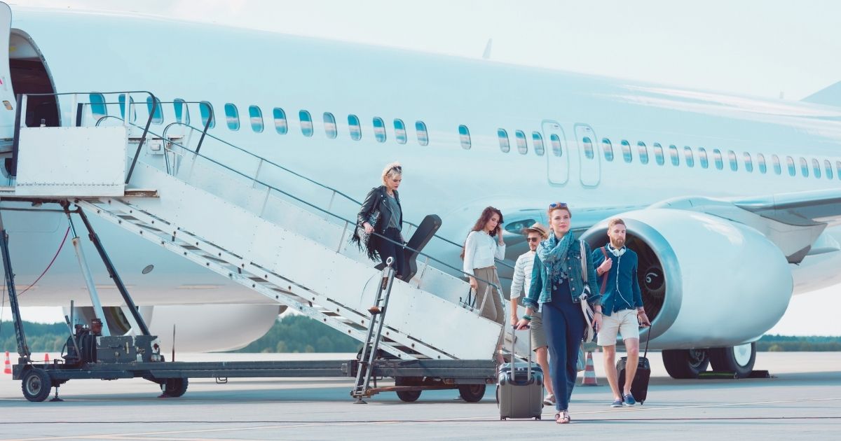 digital nomads taking a cheap flight