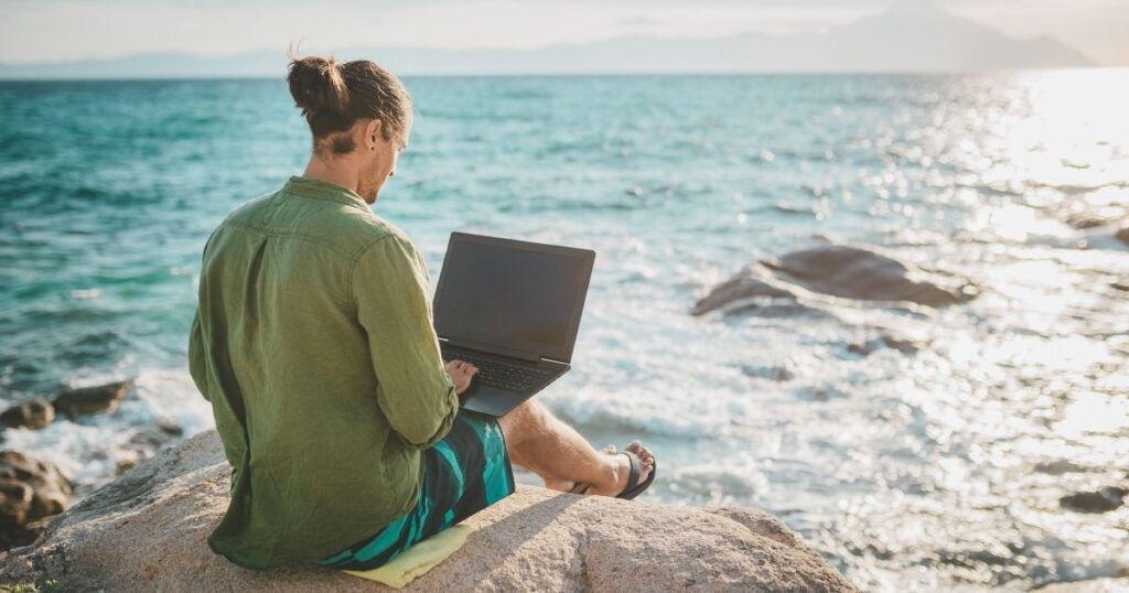 digital nomad man working from a nice spot in Malaga