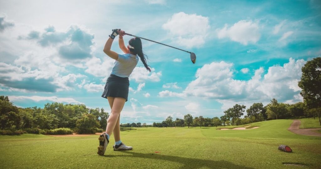 young woman playing golf in Malaga