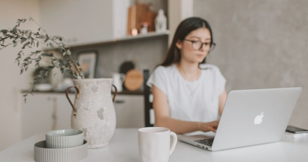young woman working remotely in Spain