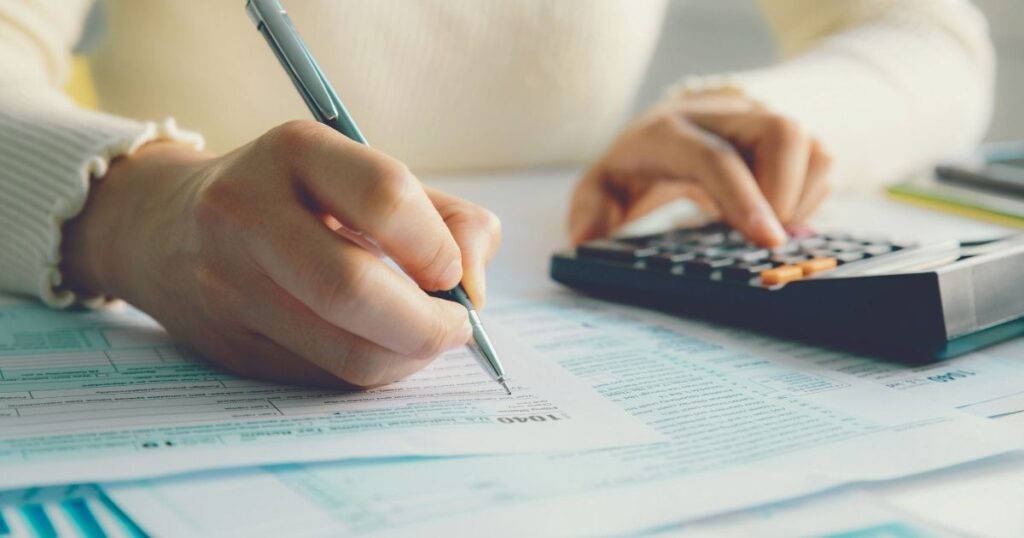 person filling tax models to keep up with taxes