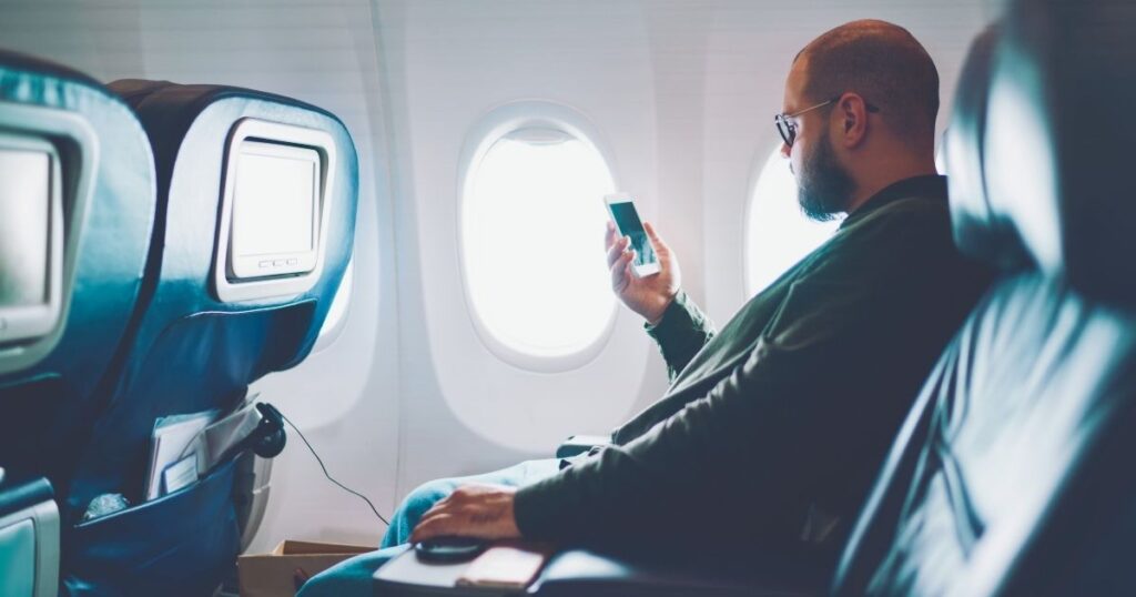 digital nomad man taking a flight