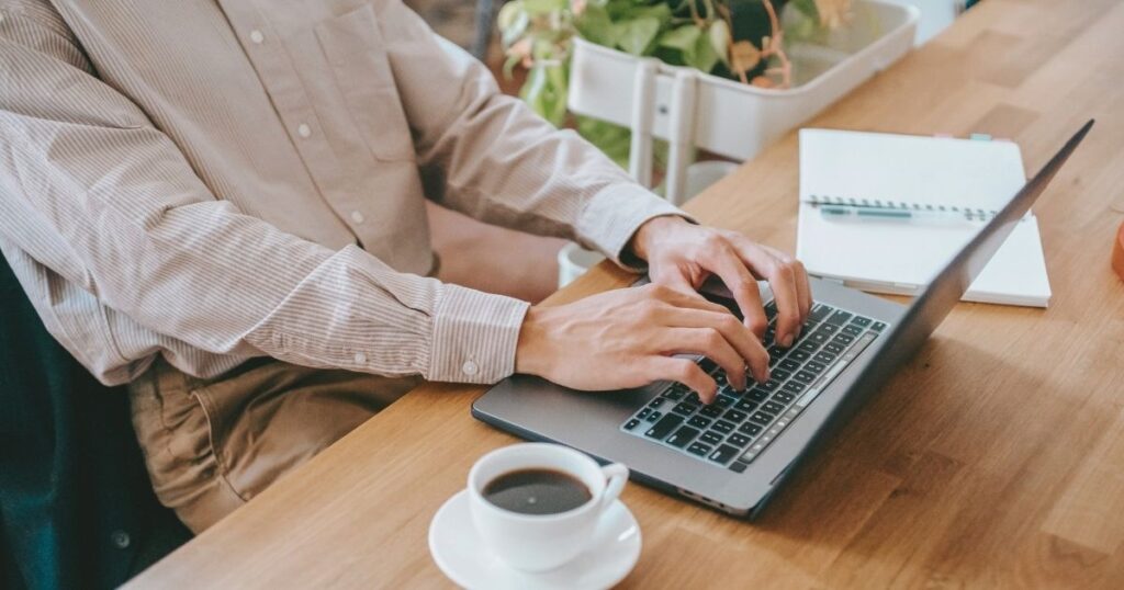 person working remotely writing