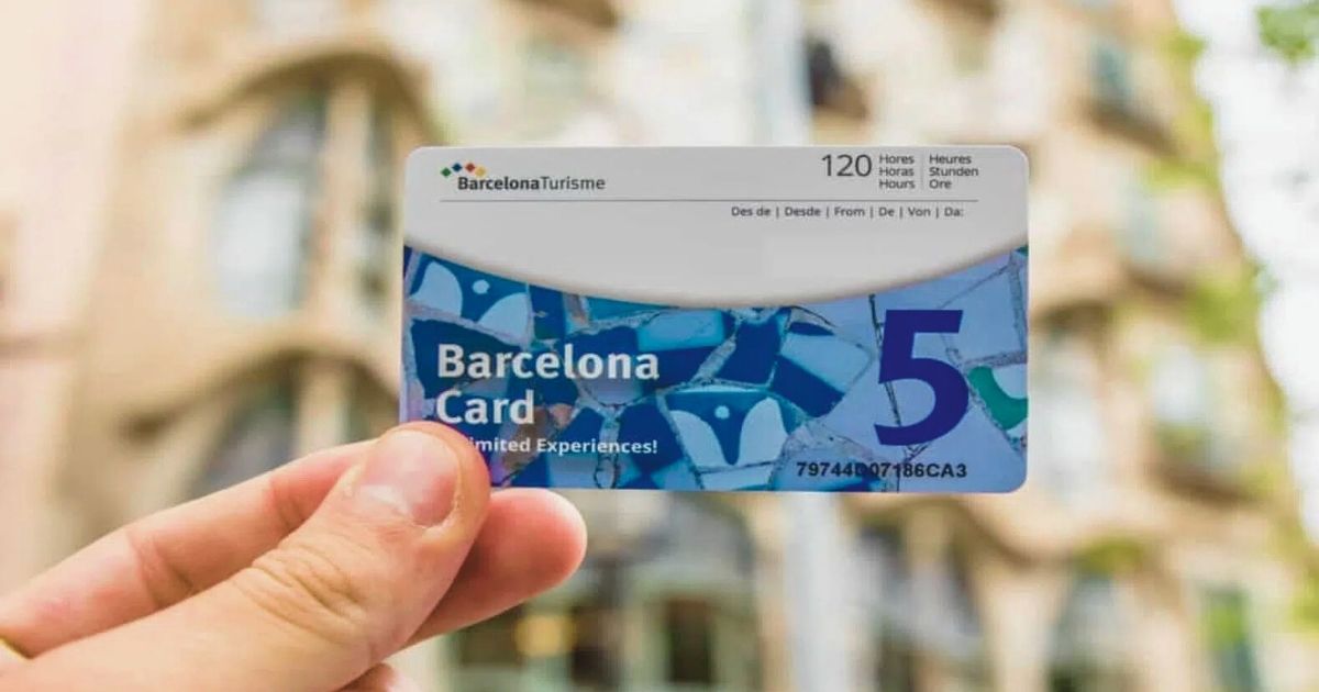 person with a Barcelona card in the hand