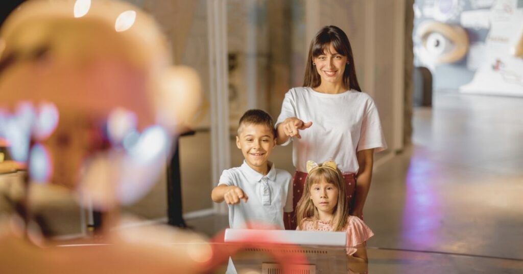 mother with her children in a interactive museum