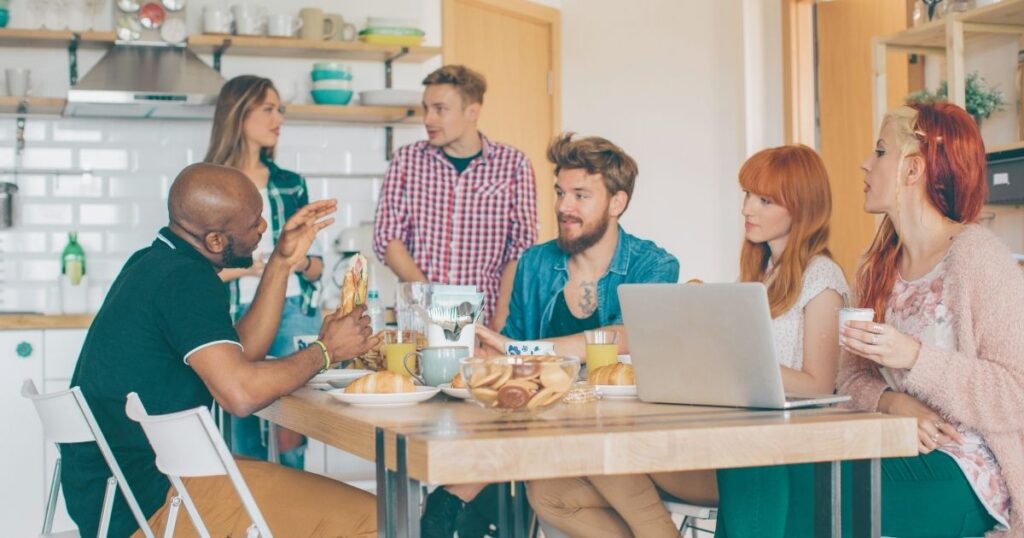friends having breakfast and working in a coliving in Barcelona