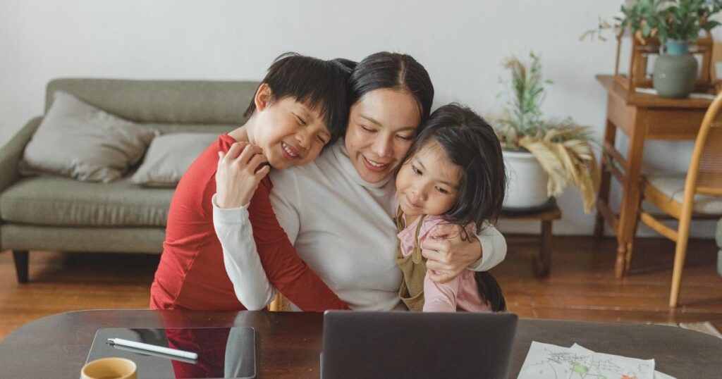 digital nomad woman working from home with kids