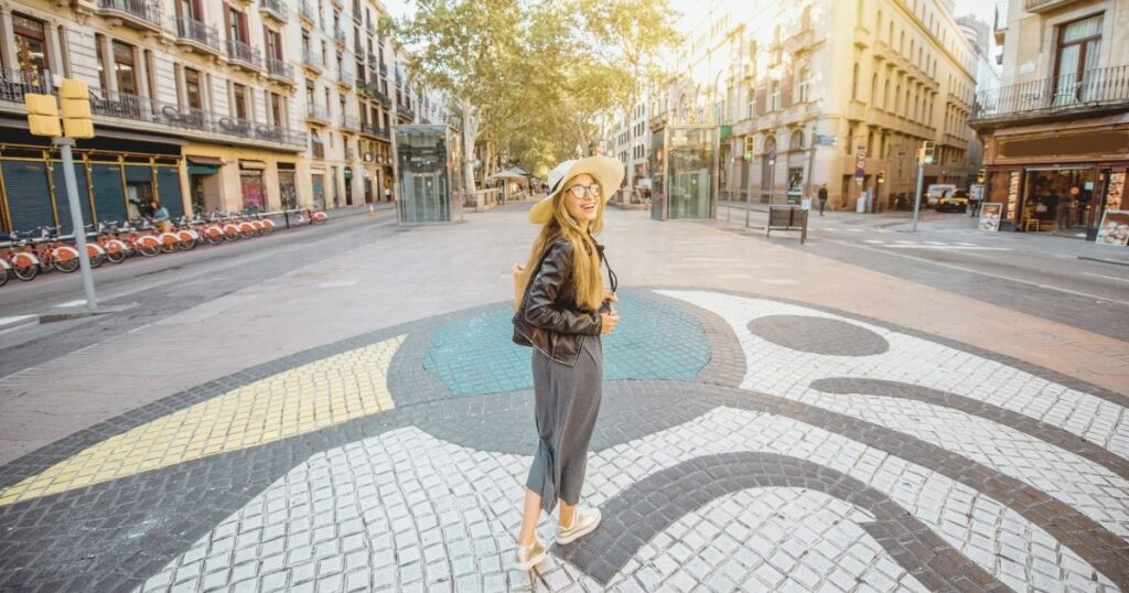young woman exploring Barcelona with safety 