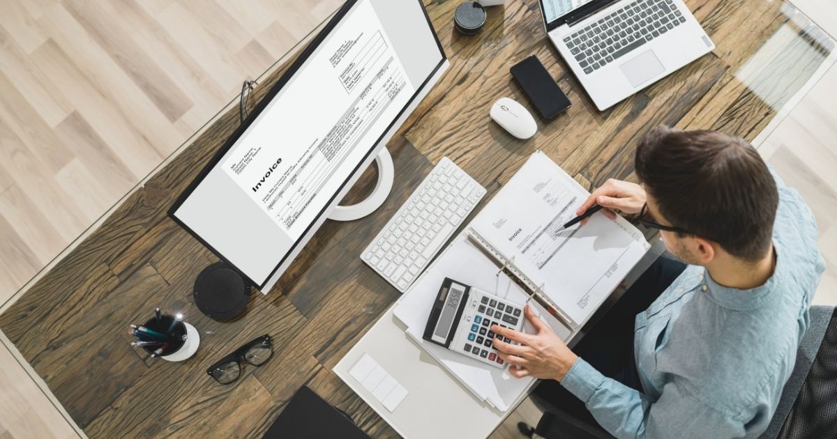 man calculating taxes to pay in Bali