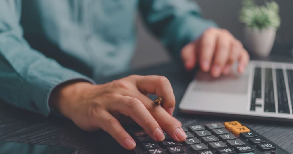 man calculating the budget to use for golf courses in Bali