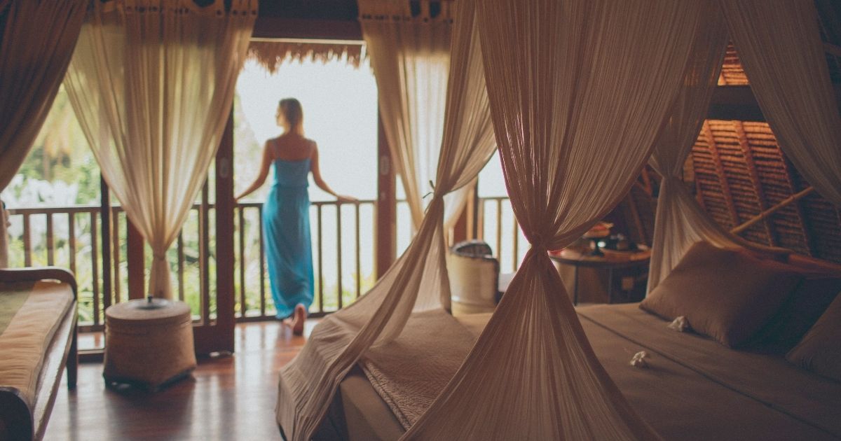 woman enjoying a cheap hotel in Bali