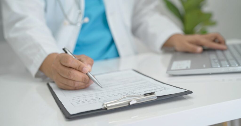doctor calculating costs of health insurance in Indonesia