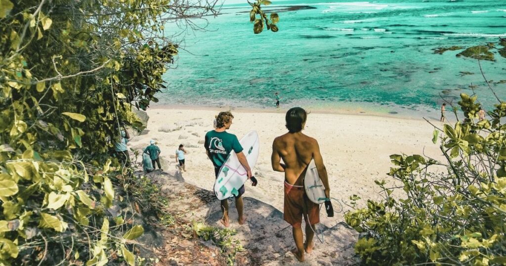young man going surfing in Bali
