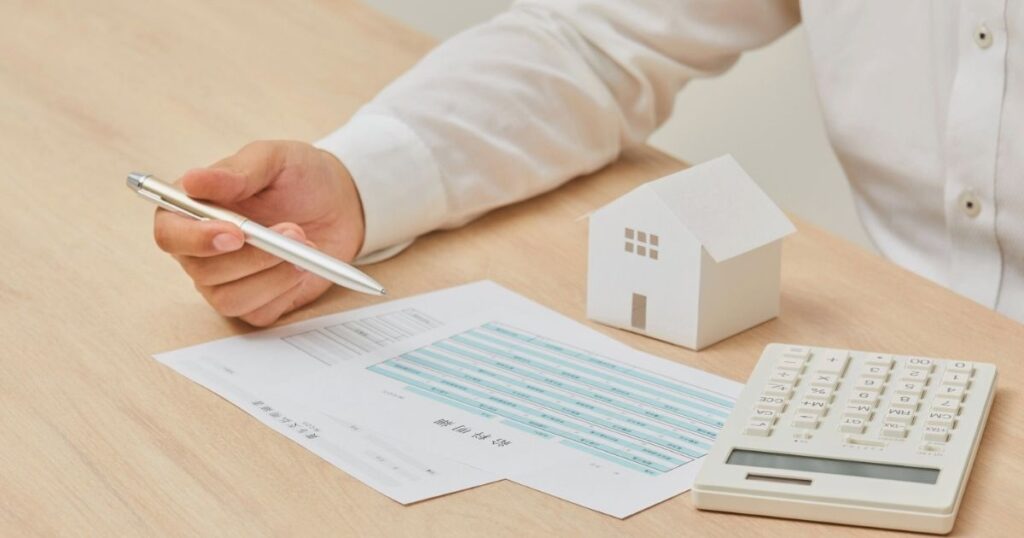 man calculating the monthly budget to live in Bali