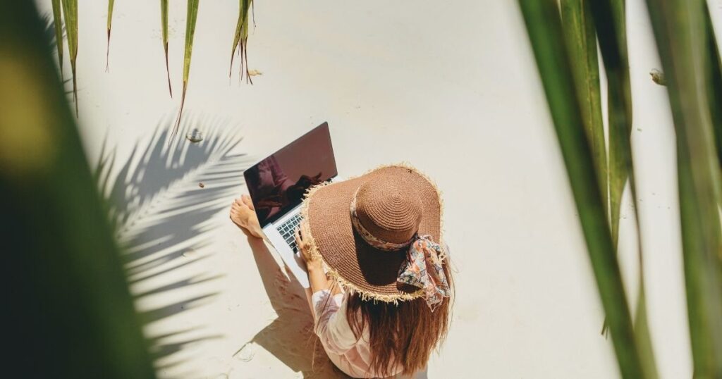 woman working from the beach in Bali