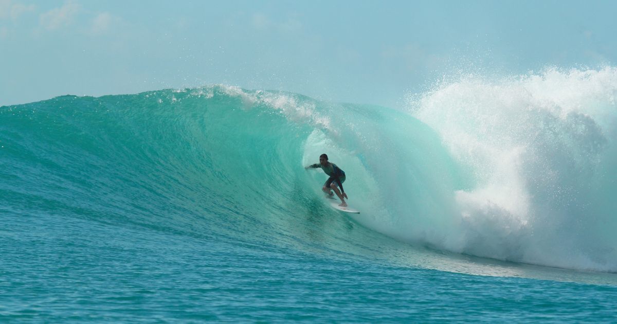 man surfing in Bali beach