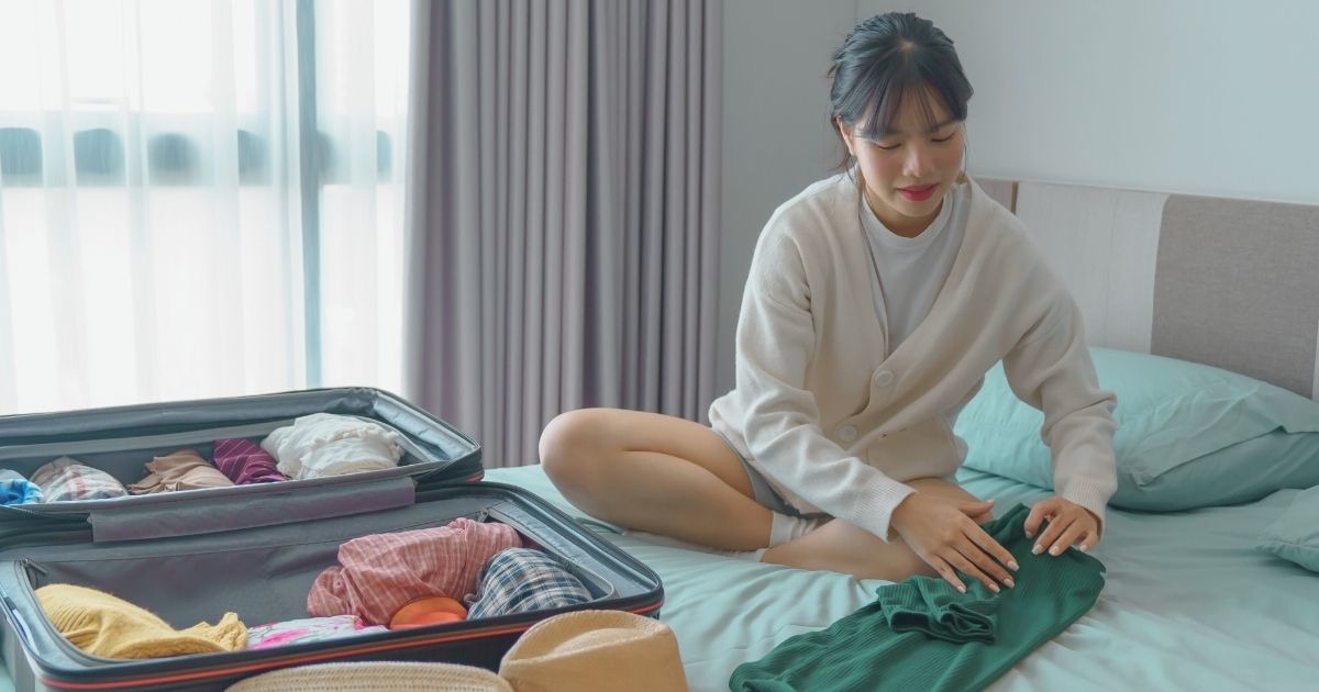 digital nomad woman packing to travel to Bali
