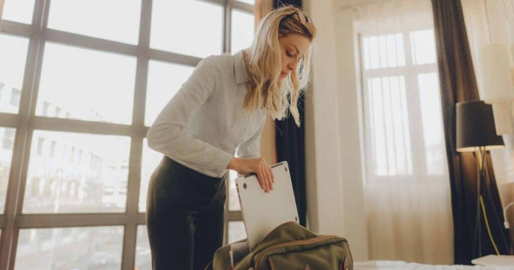 young woman packing to go to Bali