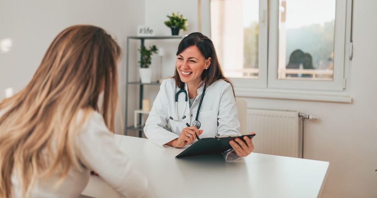 smiling doctor with a patient in Italy