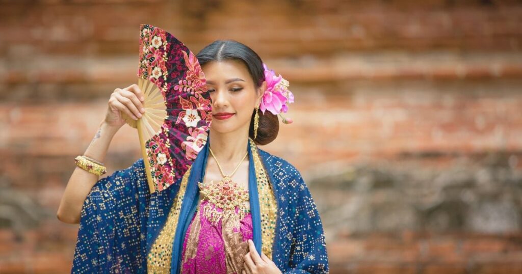 young woman wearing local clothes of Bali