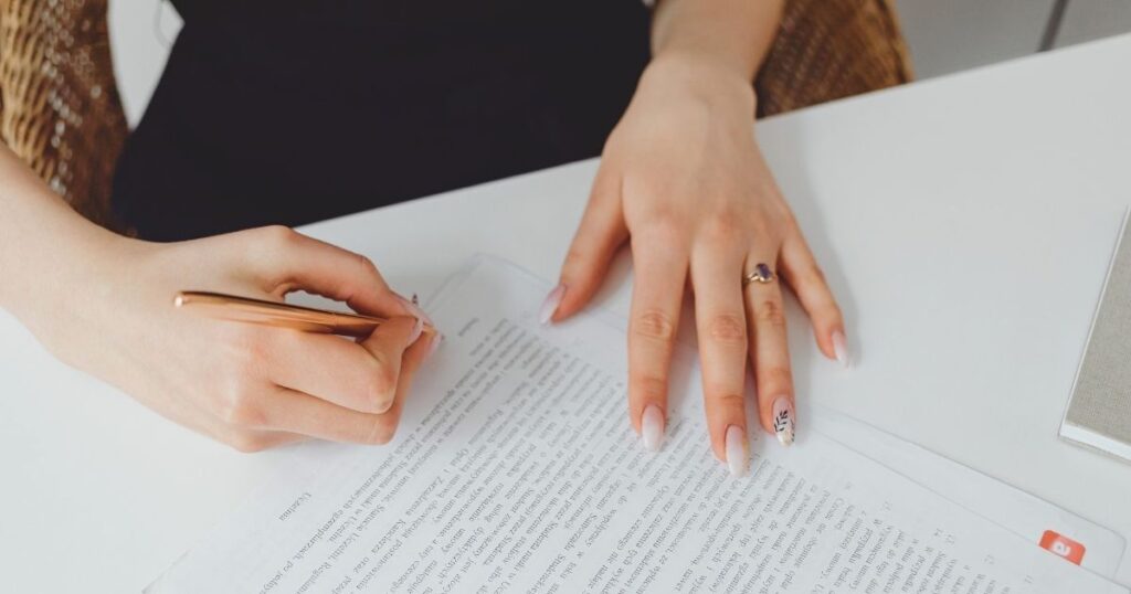 woman signing the empadronamiento form in Barcelona