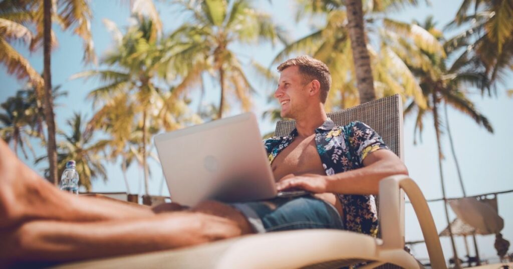 smiling man working remotely in Barcelona