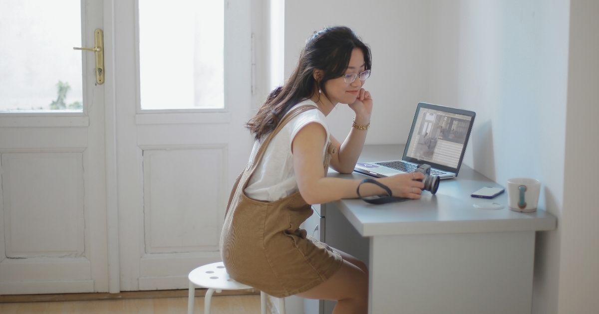 young woman using internet at home in Rome