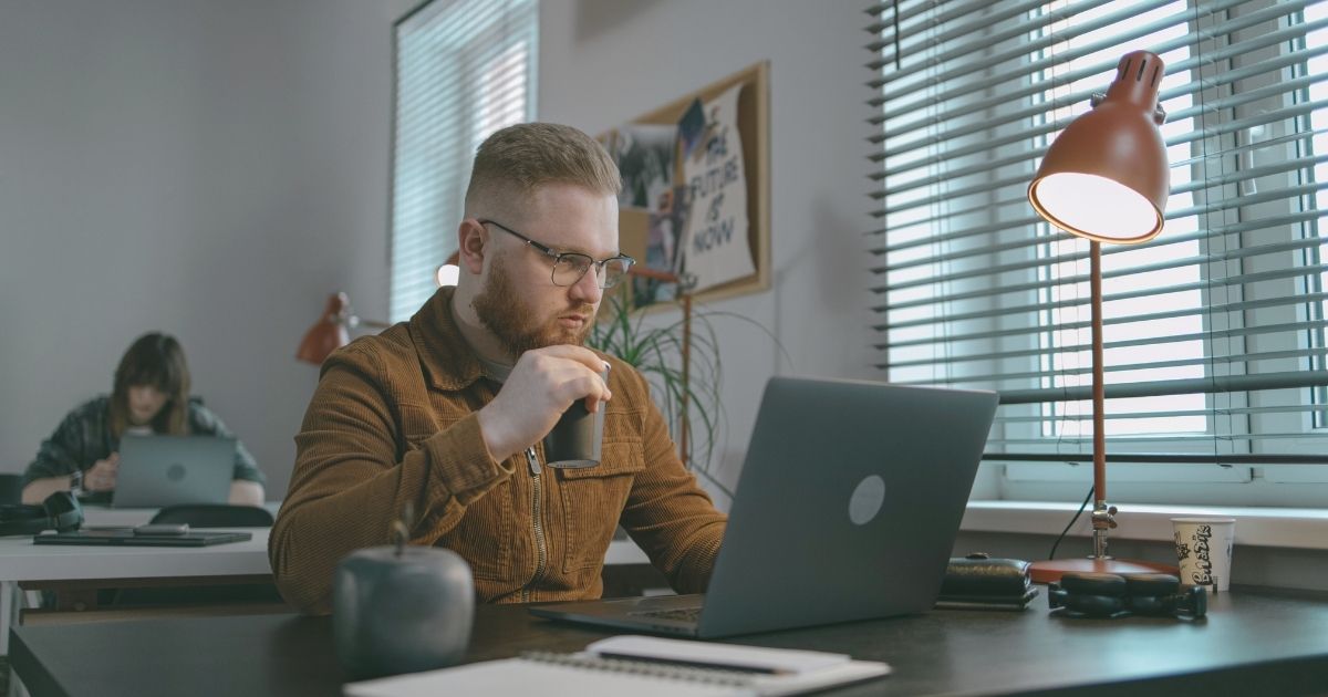 man using internet in his laptop in Russia
