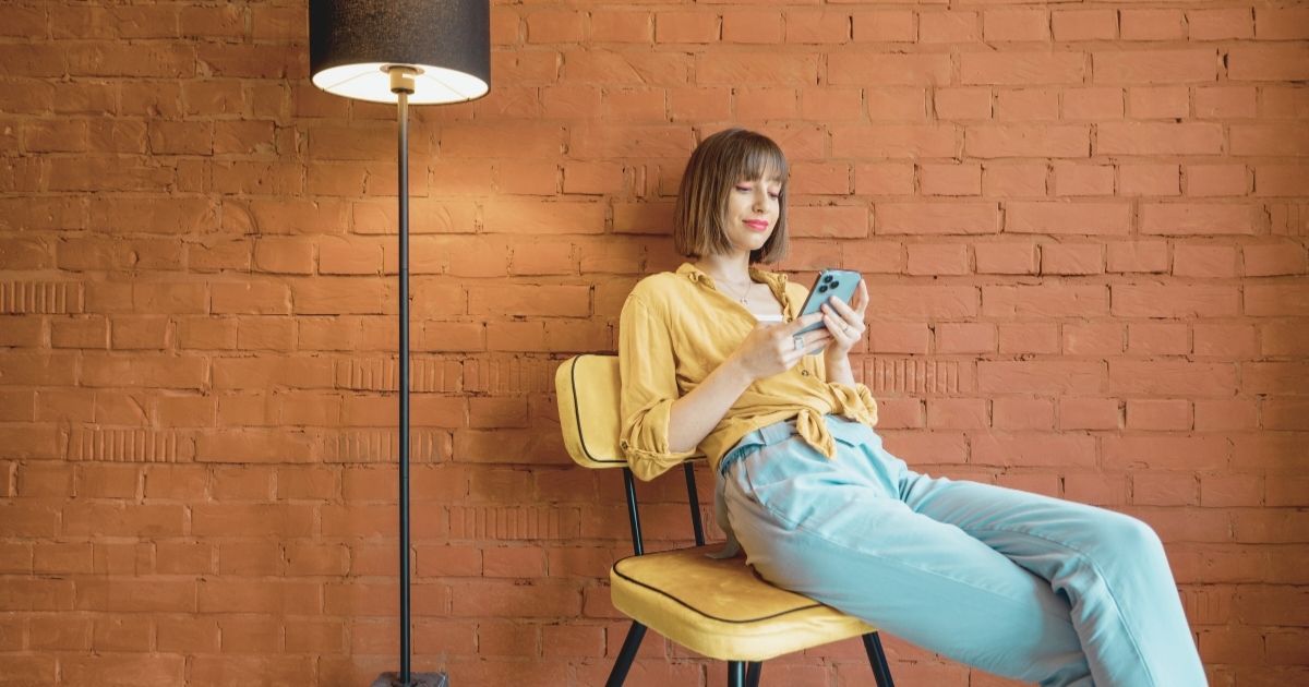 young woman comparing Saily vs Airalo esim